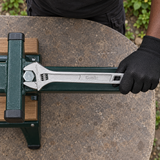 Technician using the Coofix adjustable wrench on a hex nut outdoors