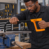 Technician using the Coofix two-tone hacksaw on a clamped metal bar