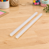 Two Coofix glue sticks on a workbench