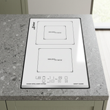White Kaiser ceramic hob installed in a compact kitchen