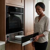 Woman opening the Kaiser La Perle dish warming drawer